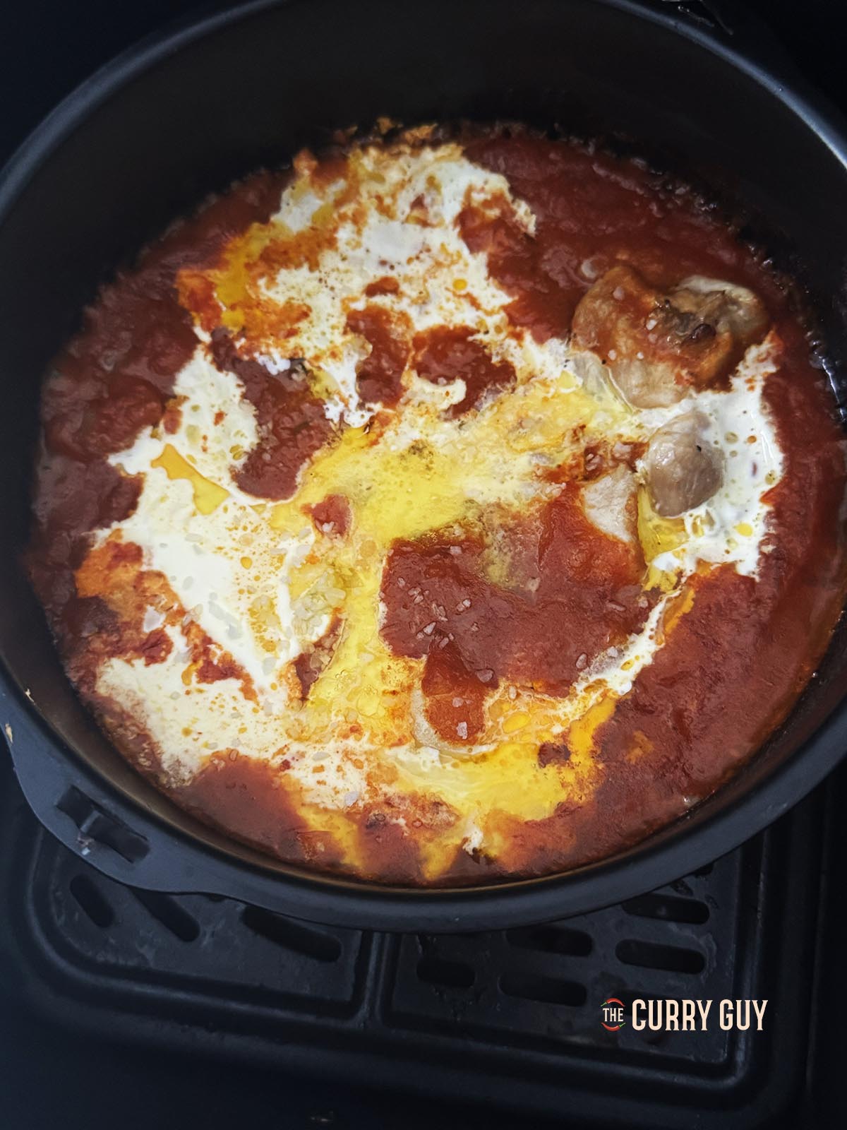 Adding the cream, butter, garam masala and kasoori methi leaves.