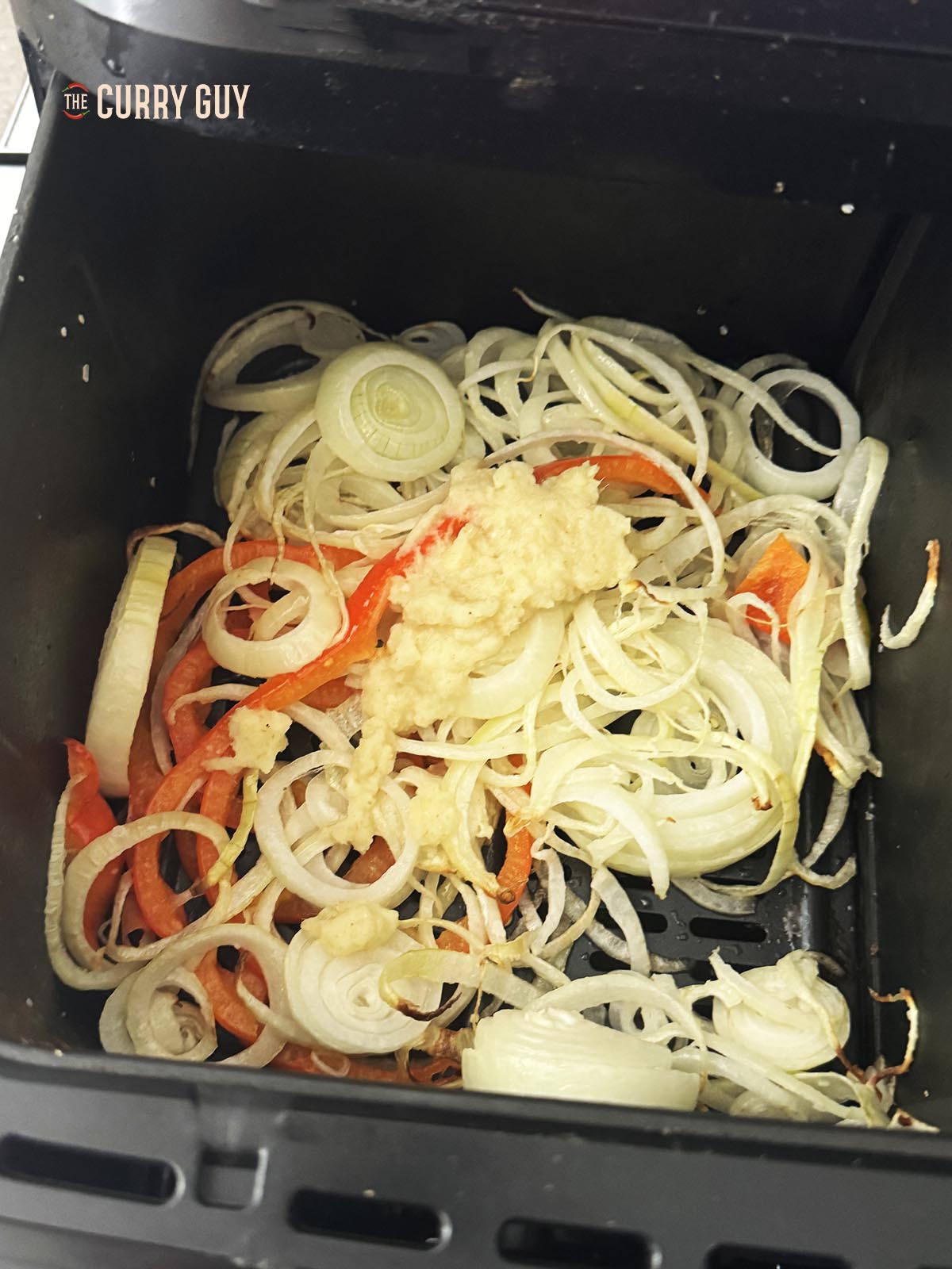 Air frying the onions, bell pepper and garlic and ginger paste.