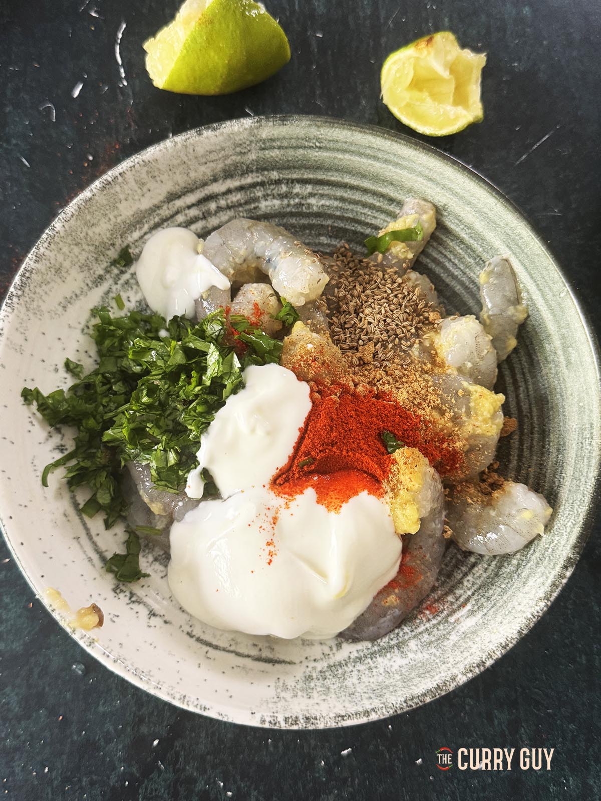 Covering the shrimp with the second marinade in a bowl. 