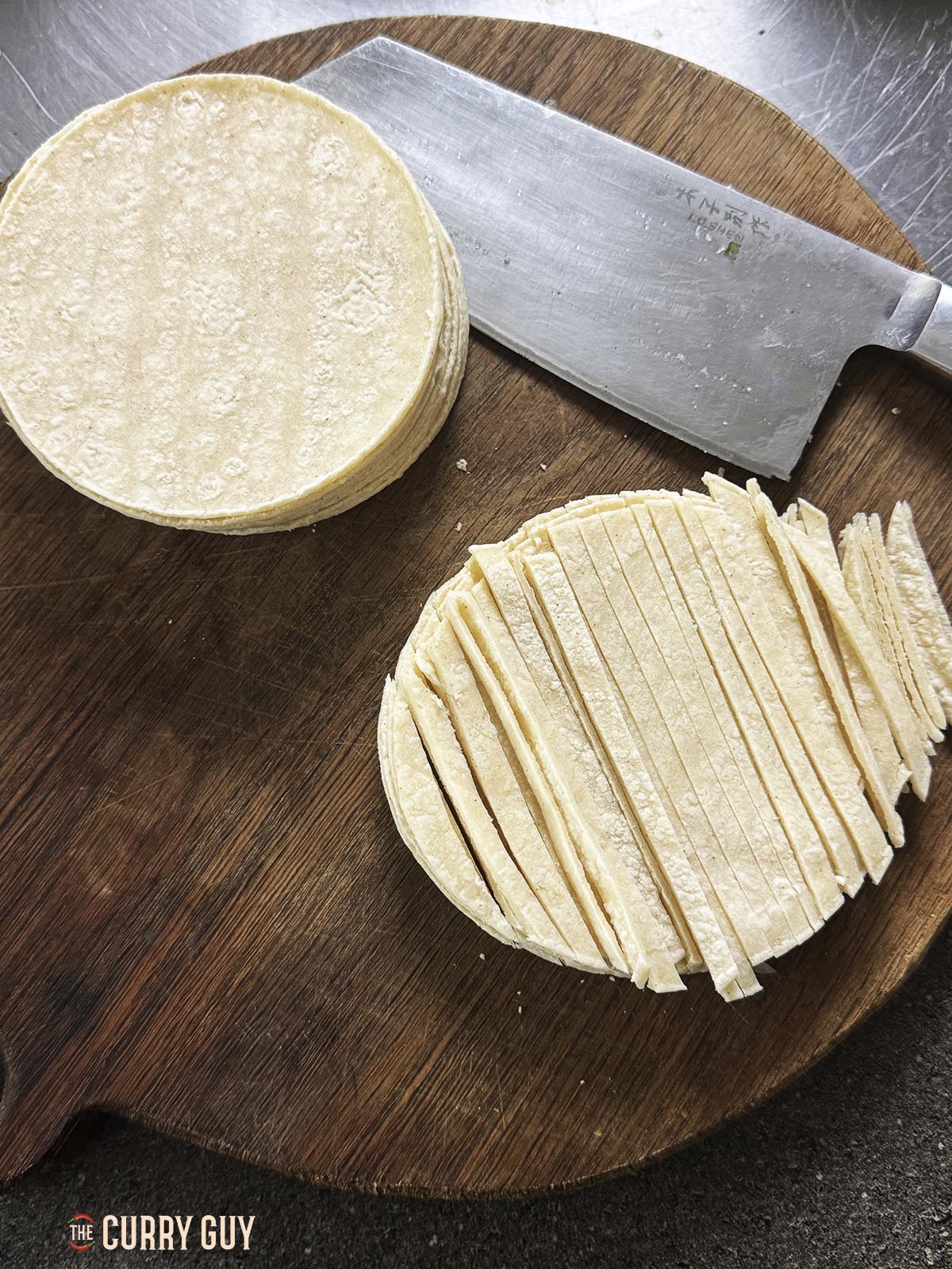 Slicing tortillas for the garnish.