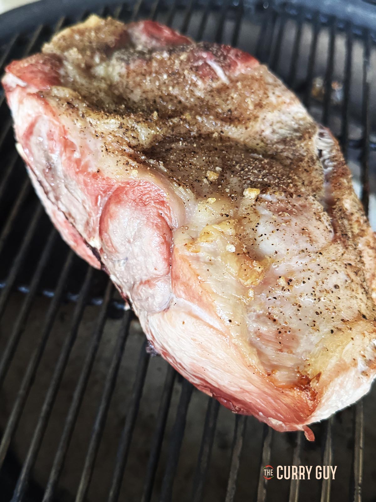 The pork shoulder after 3 hours of smoking.