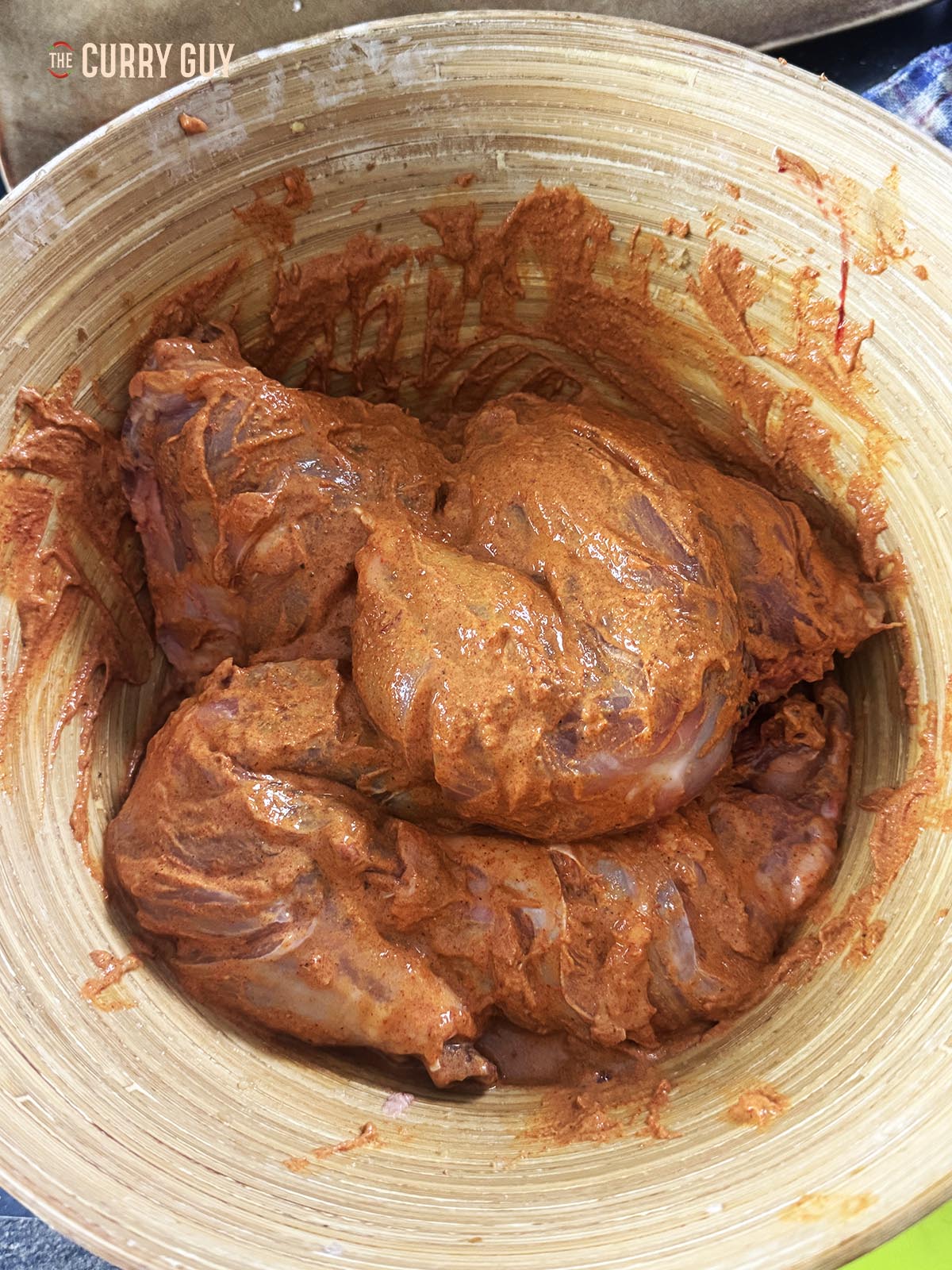 Covering the chicken with the second marinade.