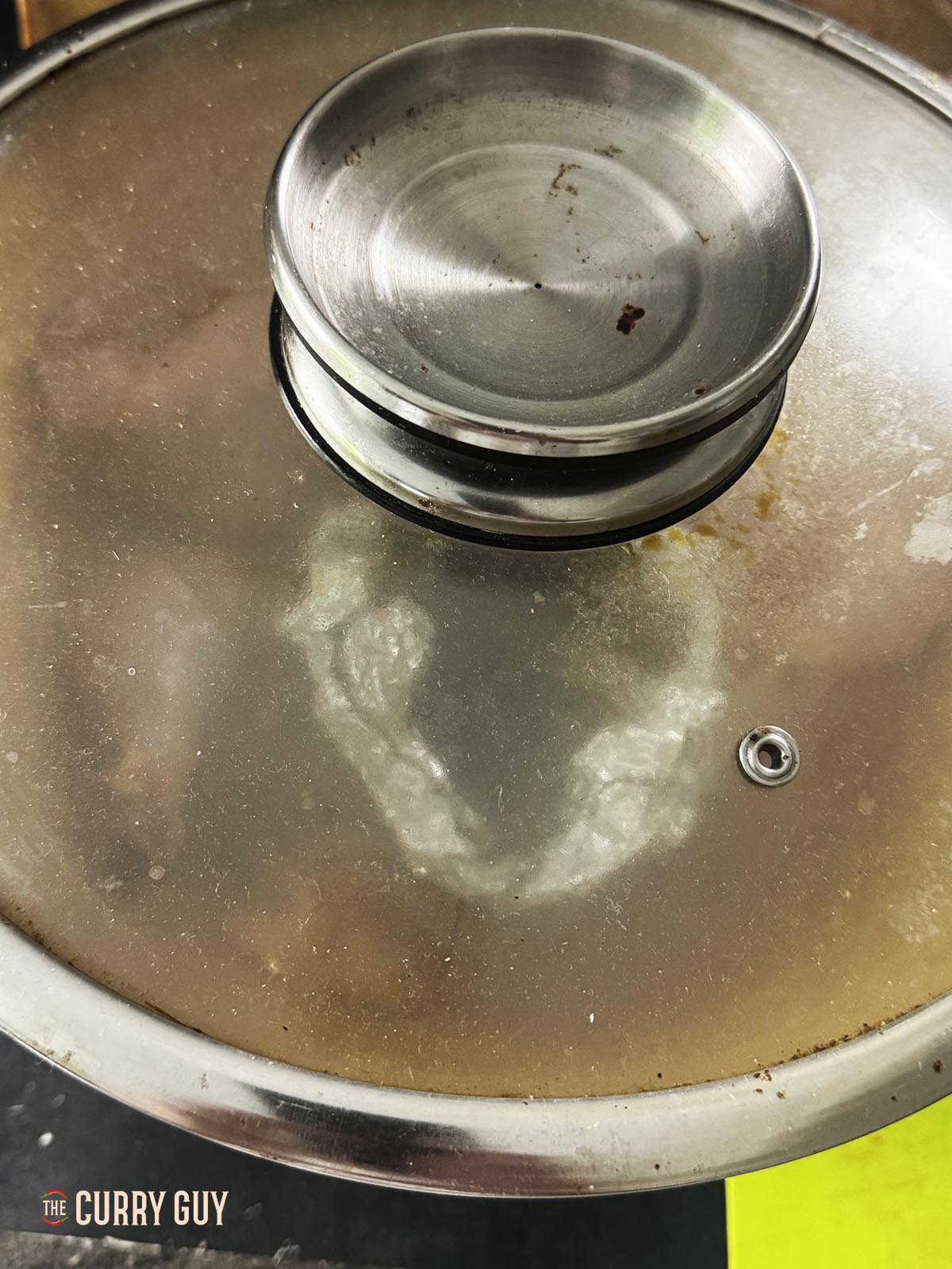 The lid on the chicken. You can see that the smoke has stopped.