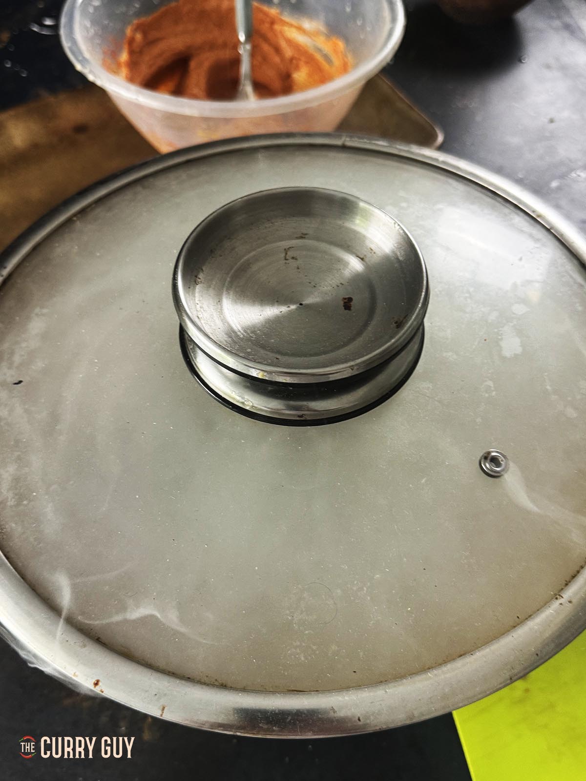 Smoking the marinating chicken in the mixing bowl.