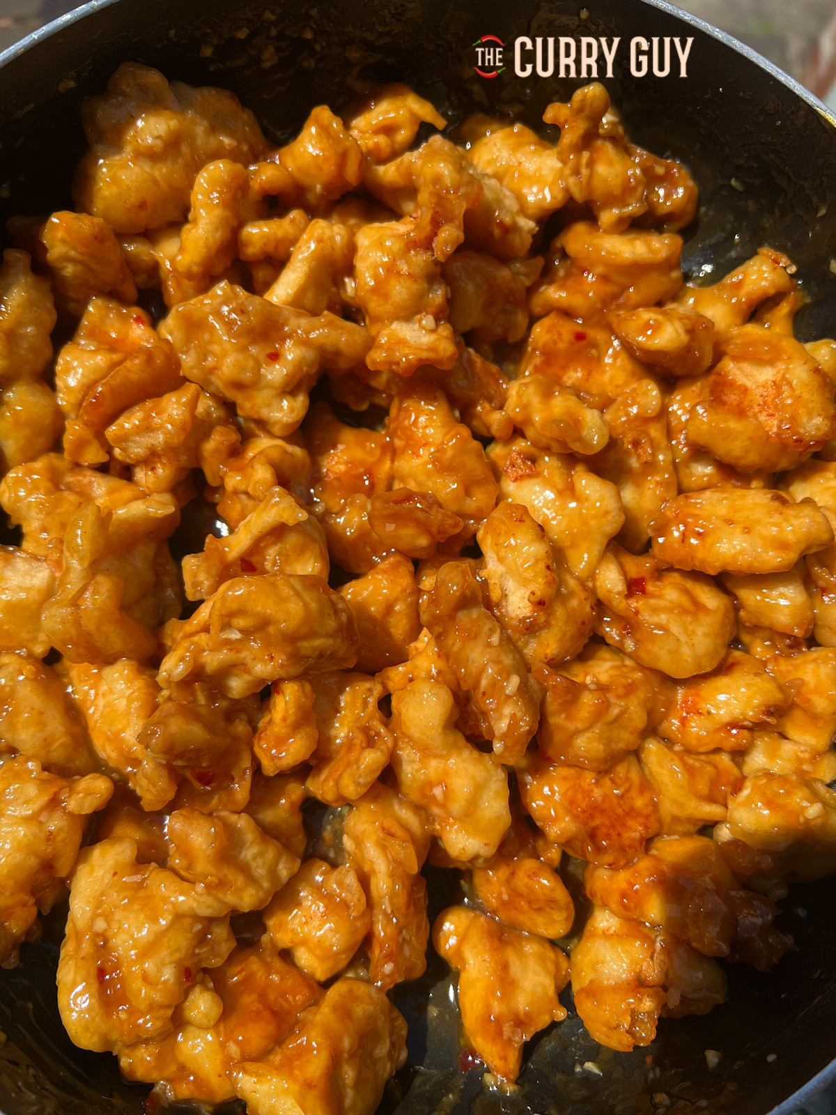 orange chicken in a pan ready to serve. 