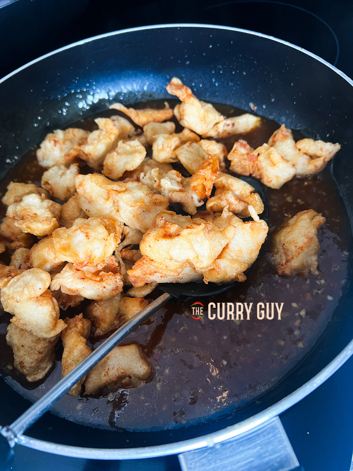 Chicken added to the pan for the Panda Express Orange Chicken.