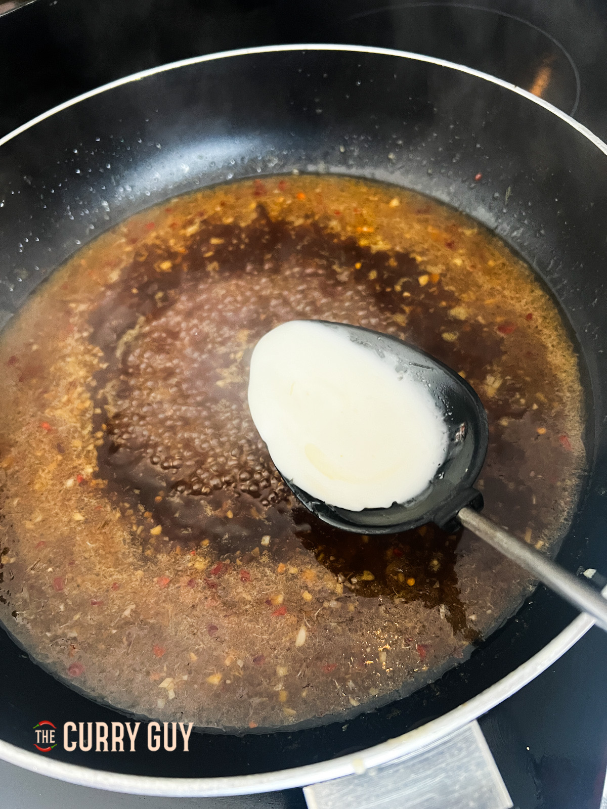 thickening the sauce in the pan. 