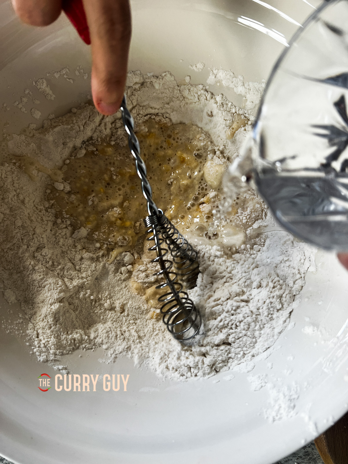 Making the batter for the panda express orange chicken. 