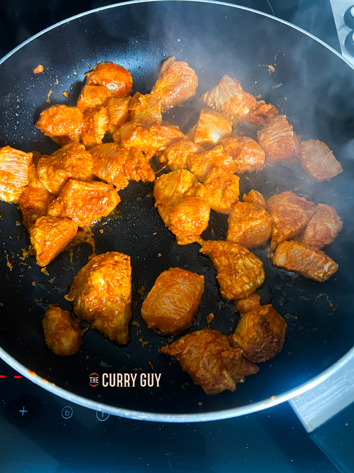 chicken frying in the pan