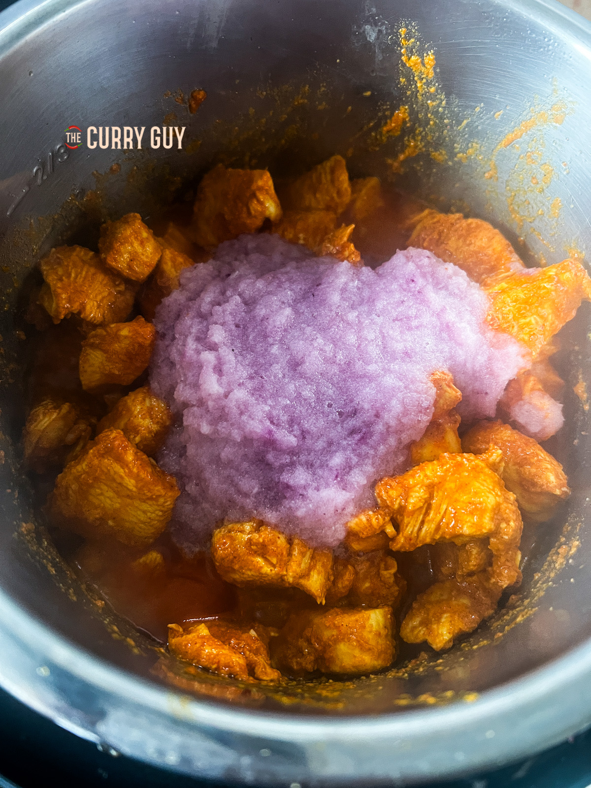 Red onion added to the pan.