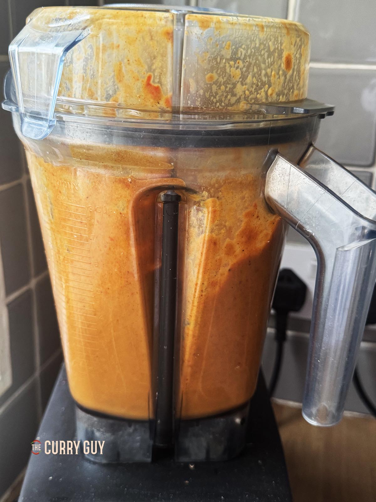 Blending the sauce ingredients until smooth.
