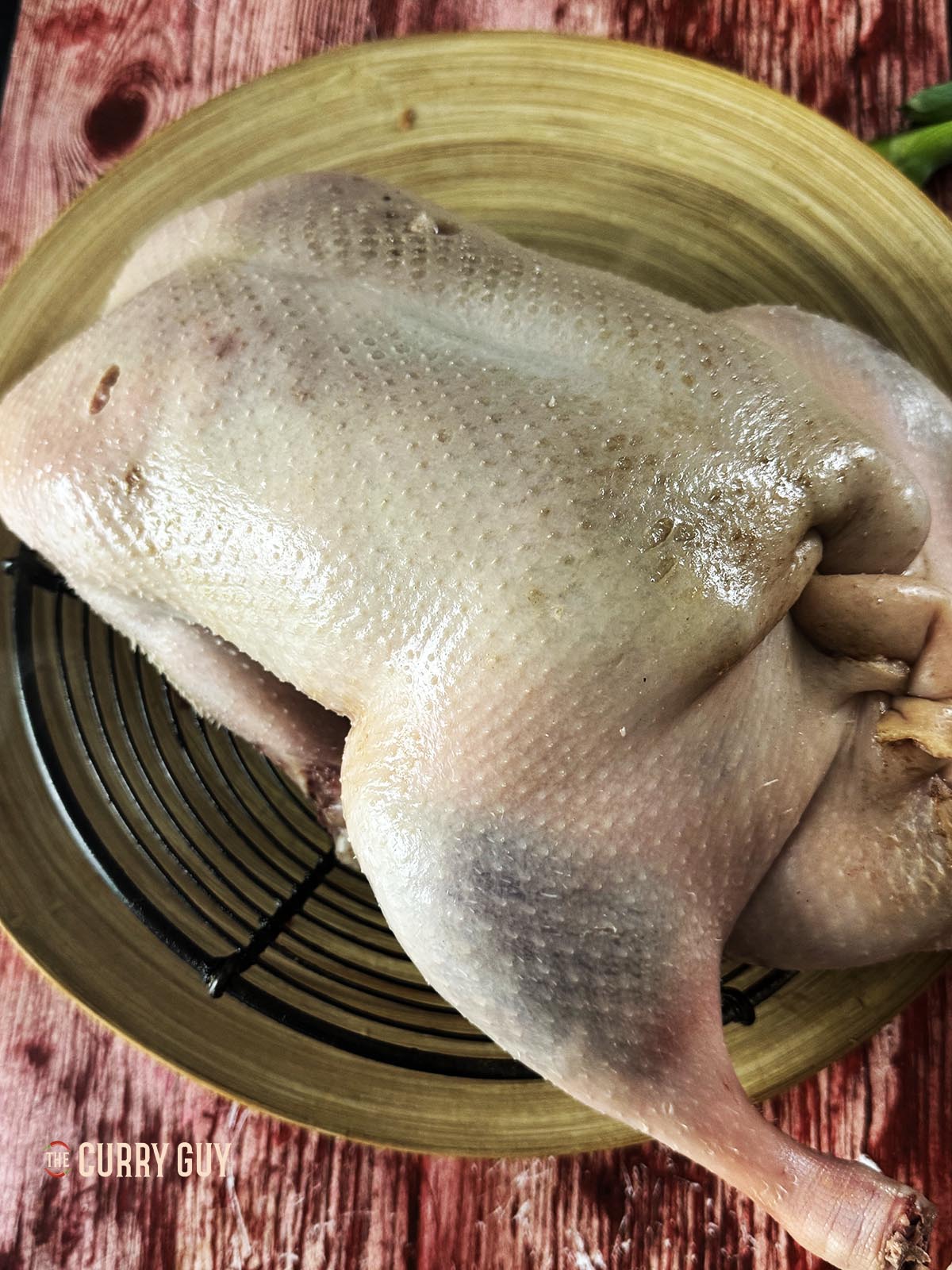 Letting the duck rest, uncovered in the fridge for a day.