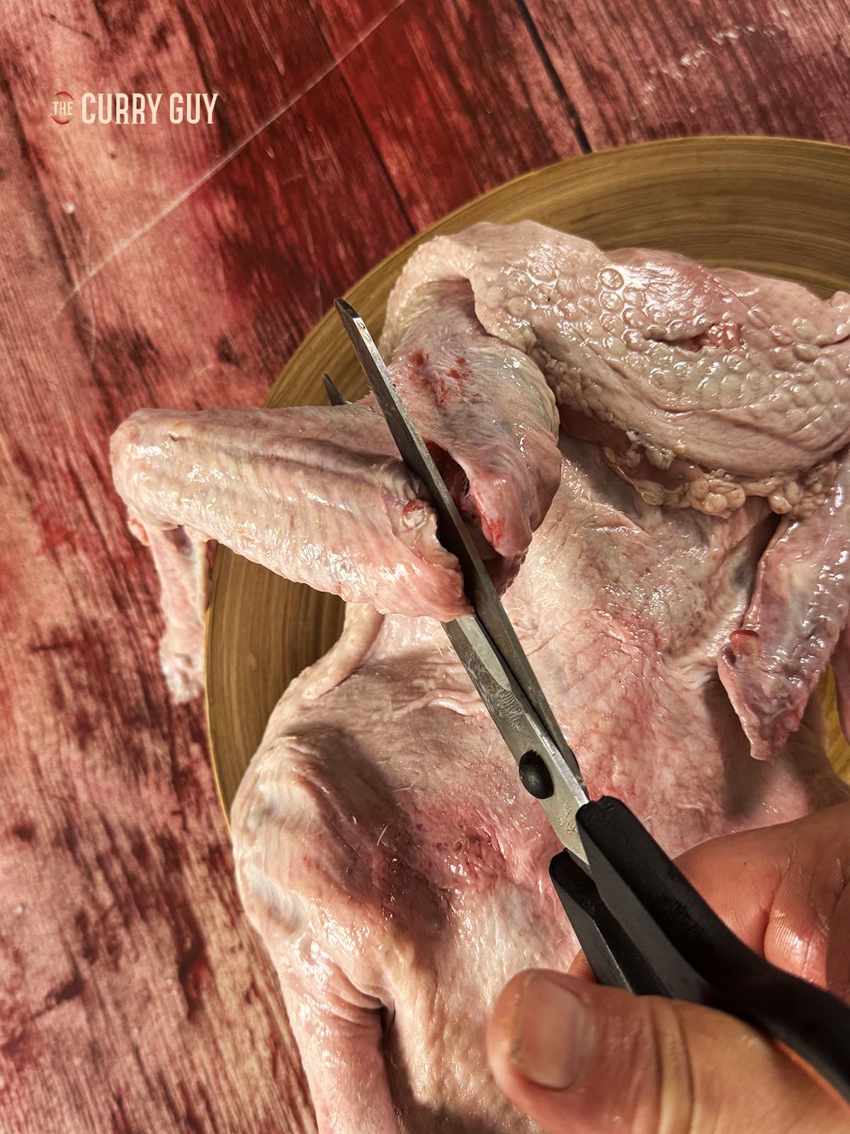 Cutting off the wing tips to neaten it up.