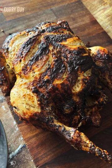 South Indian Tandoori Chicken on a cutting board.