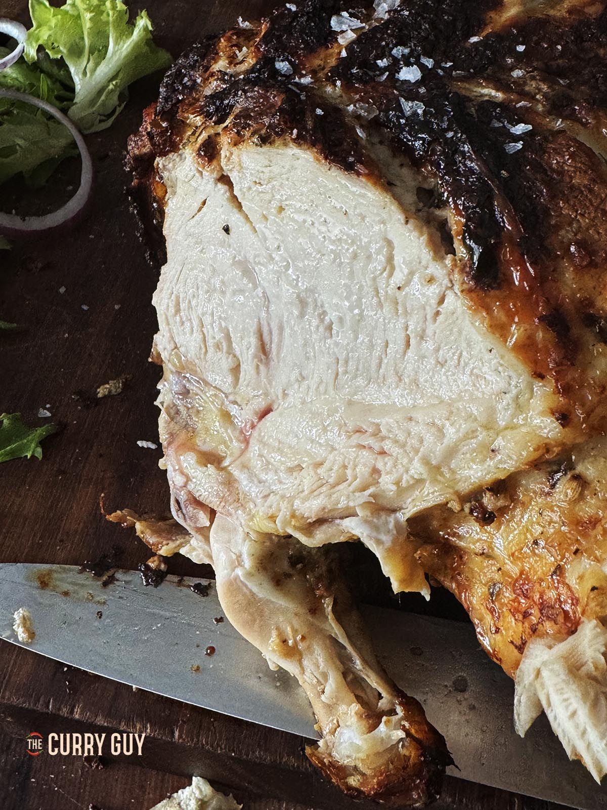 The chicken sliced into showing how moist the meat is.