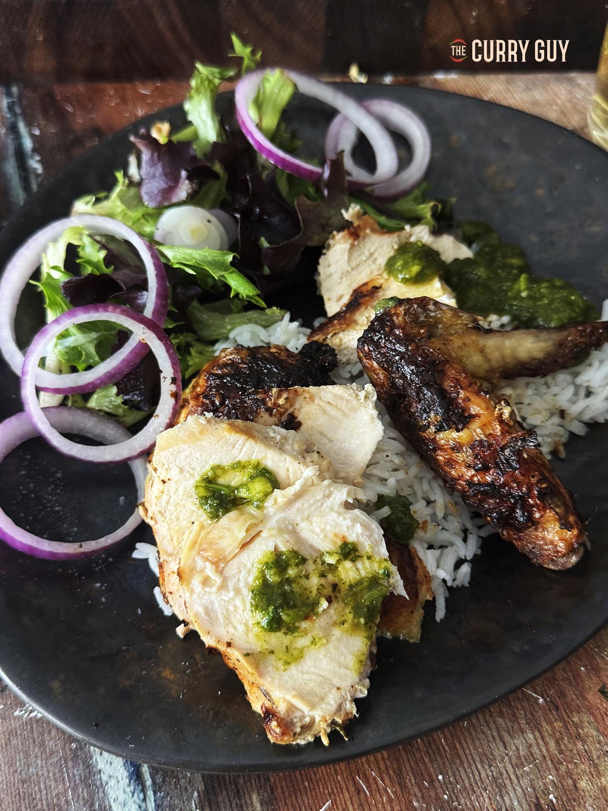 The chicken plated up. This is a close up detailed photo.