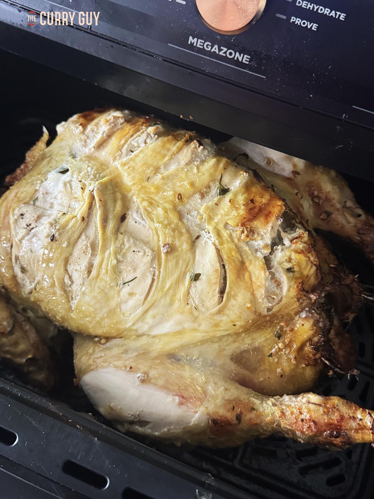 The chicken breast side up in the air fryer.