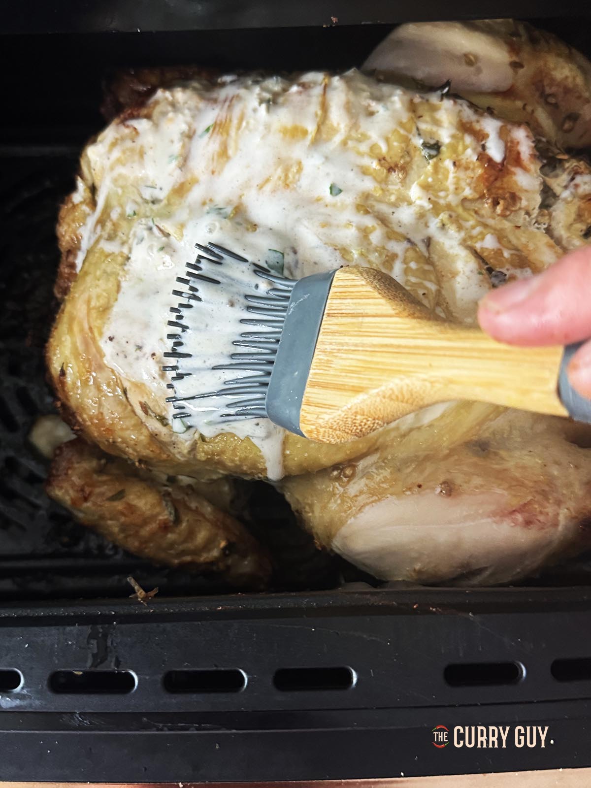 Basting the chicken with the marinade before cooking it for an additional 20 minutes