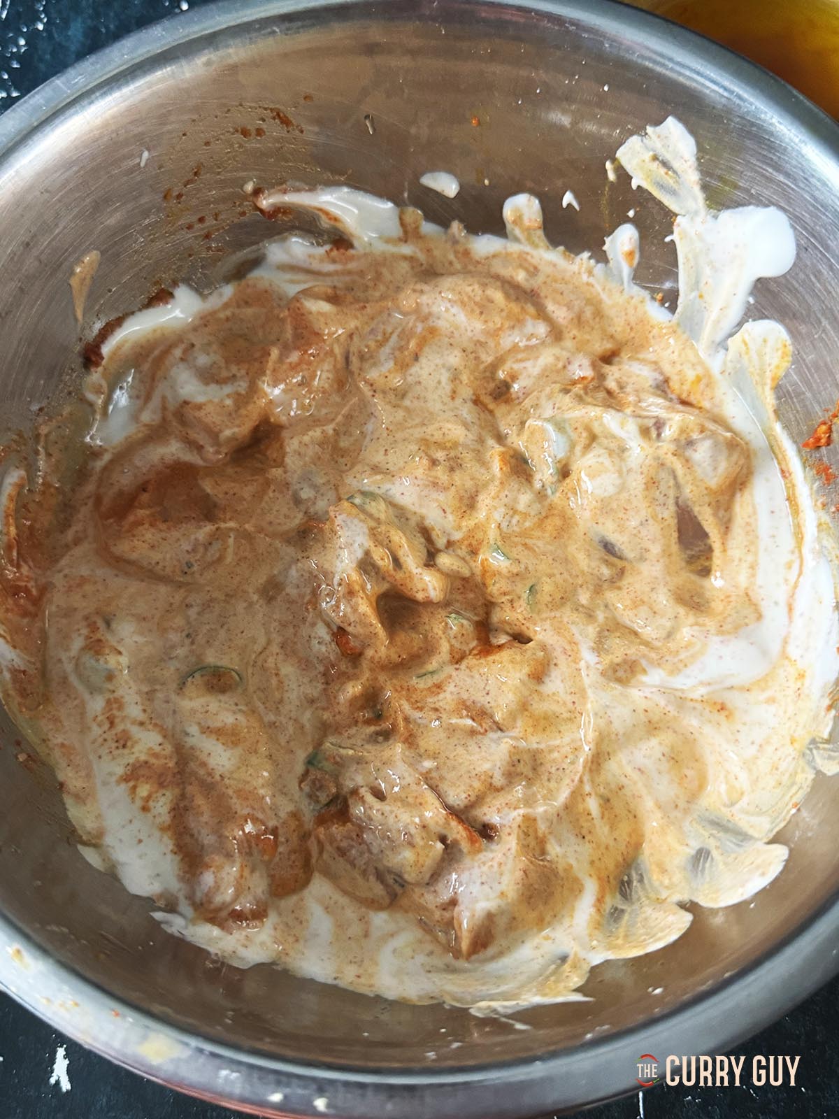 Marinating the chicken. 