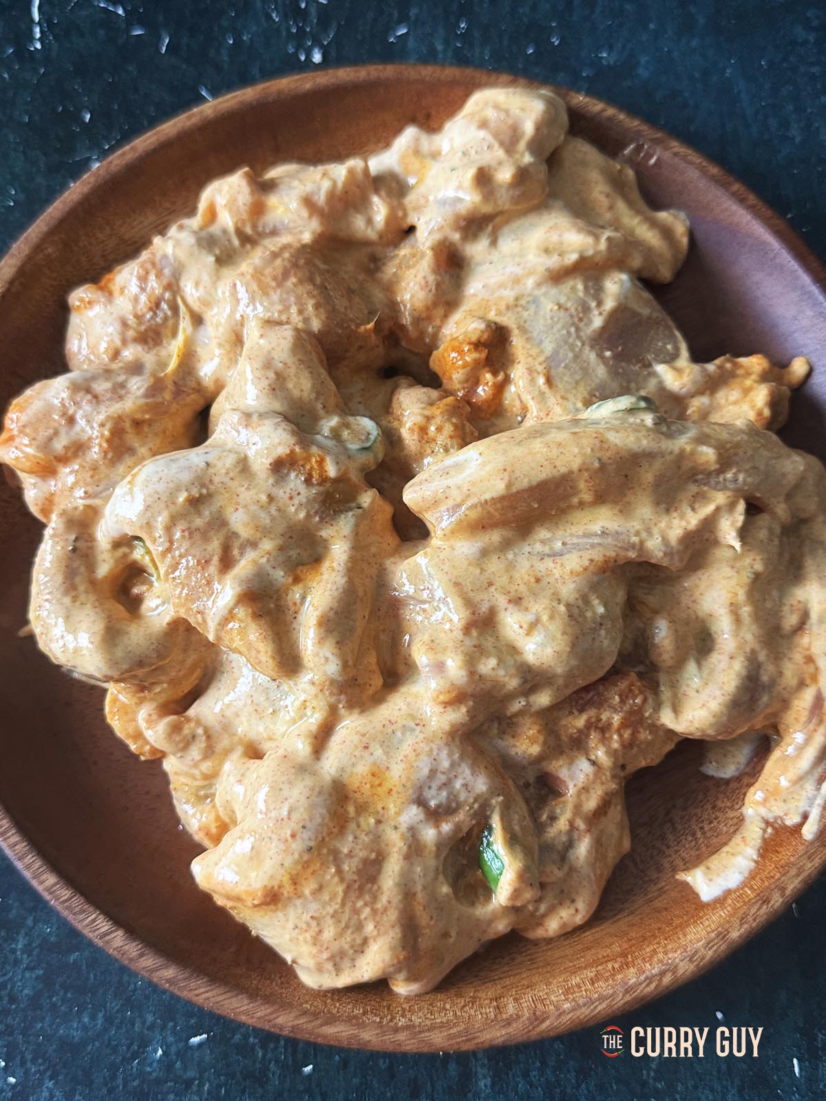 Transferring the chicken to a plate.