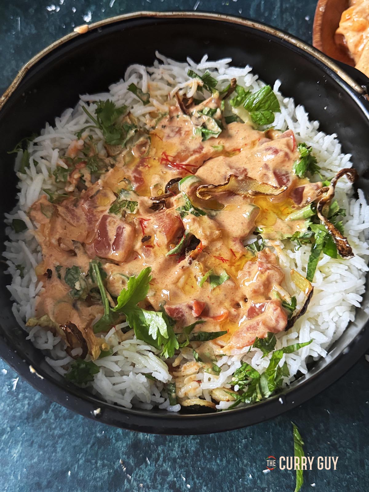 Adding the next layer to the biryani.