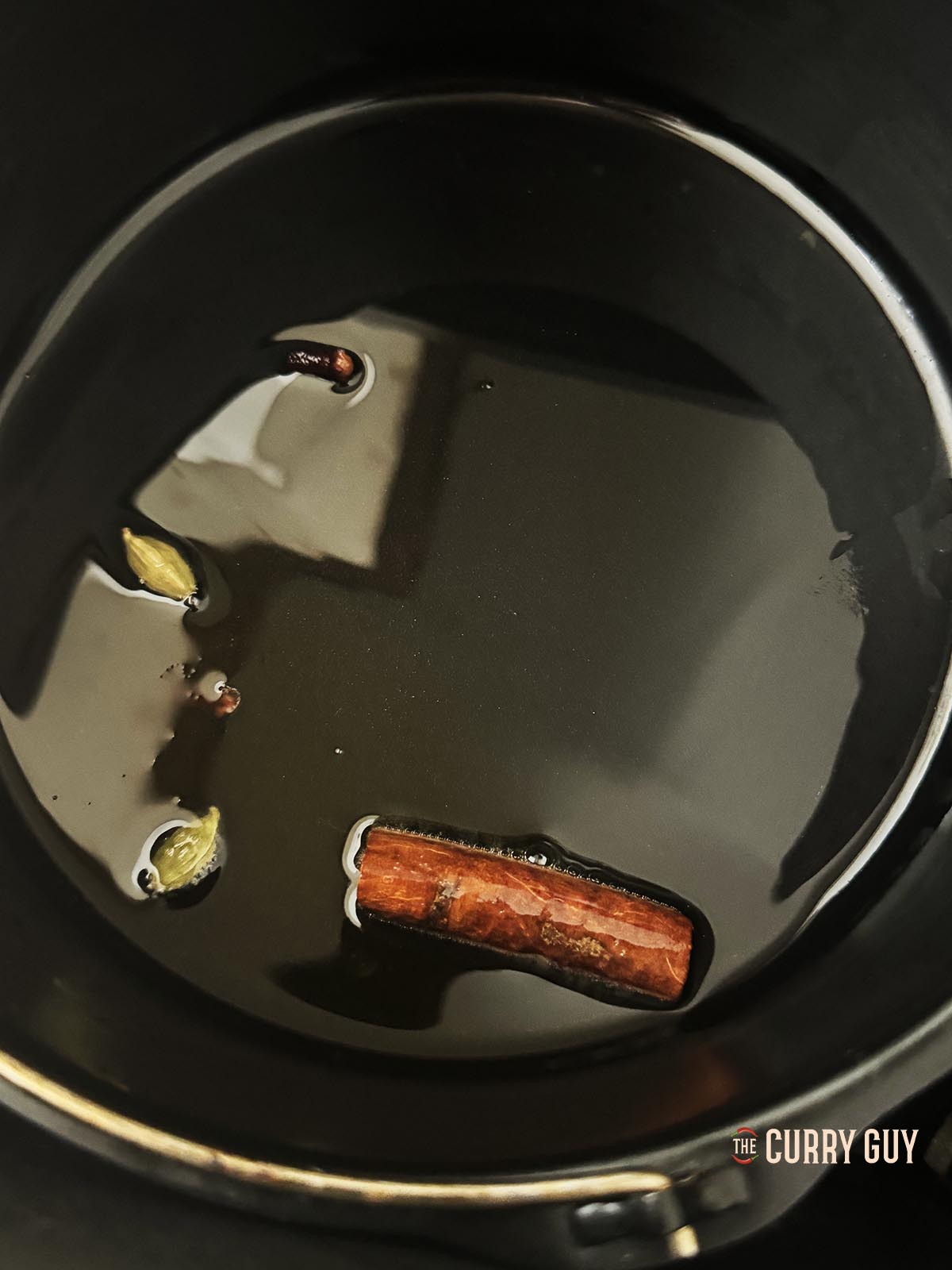 Tempering whole spices in a cake tin in the air fryer.