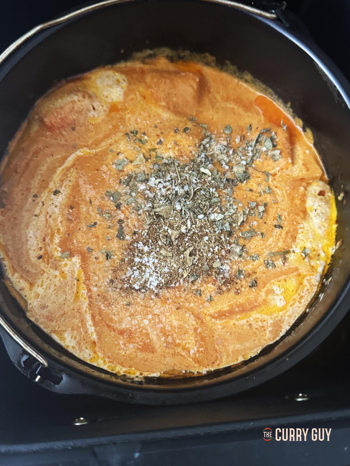 Adding kasoori methi and salt to the sauce. 