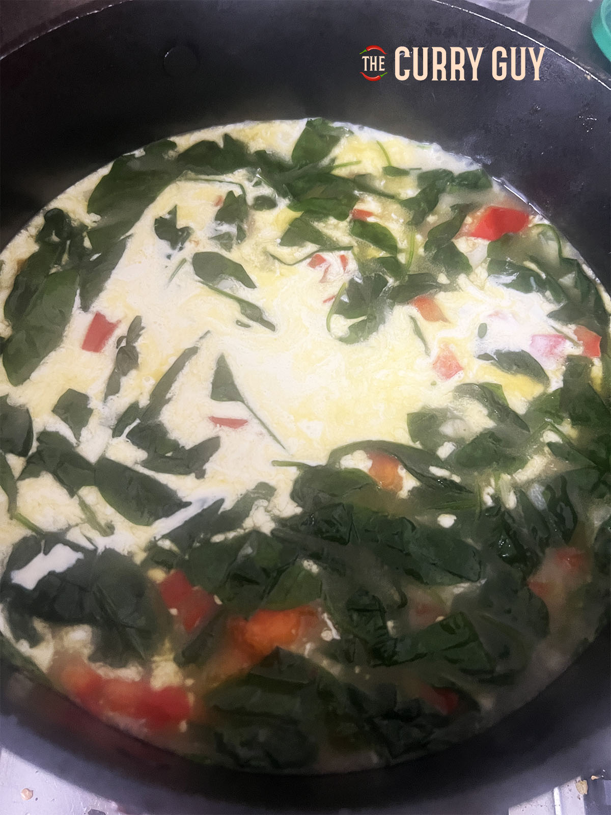 Stirring in the double cream.