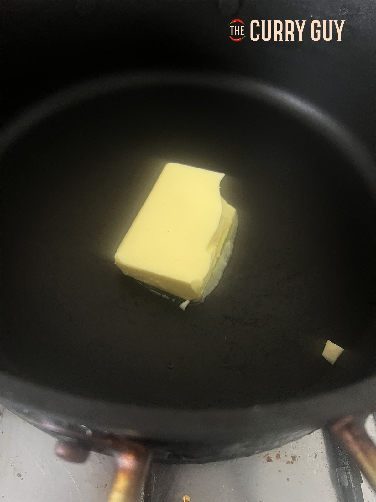 The butter melting in a pan.