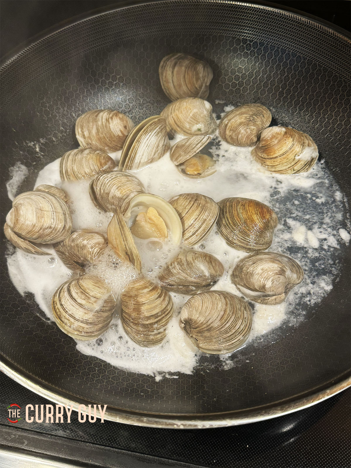 The clams gently simmering.