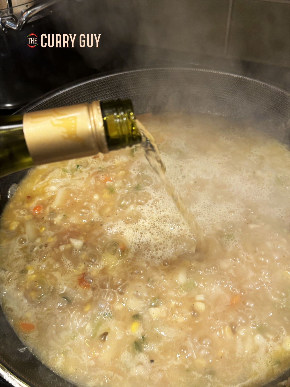 Pouring in some white wine