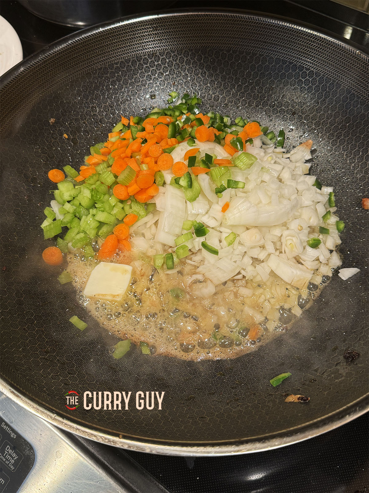 Carrots, onion, celery and pepper frying