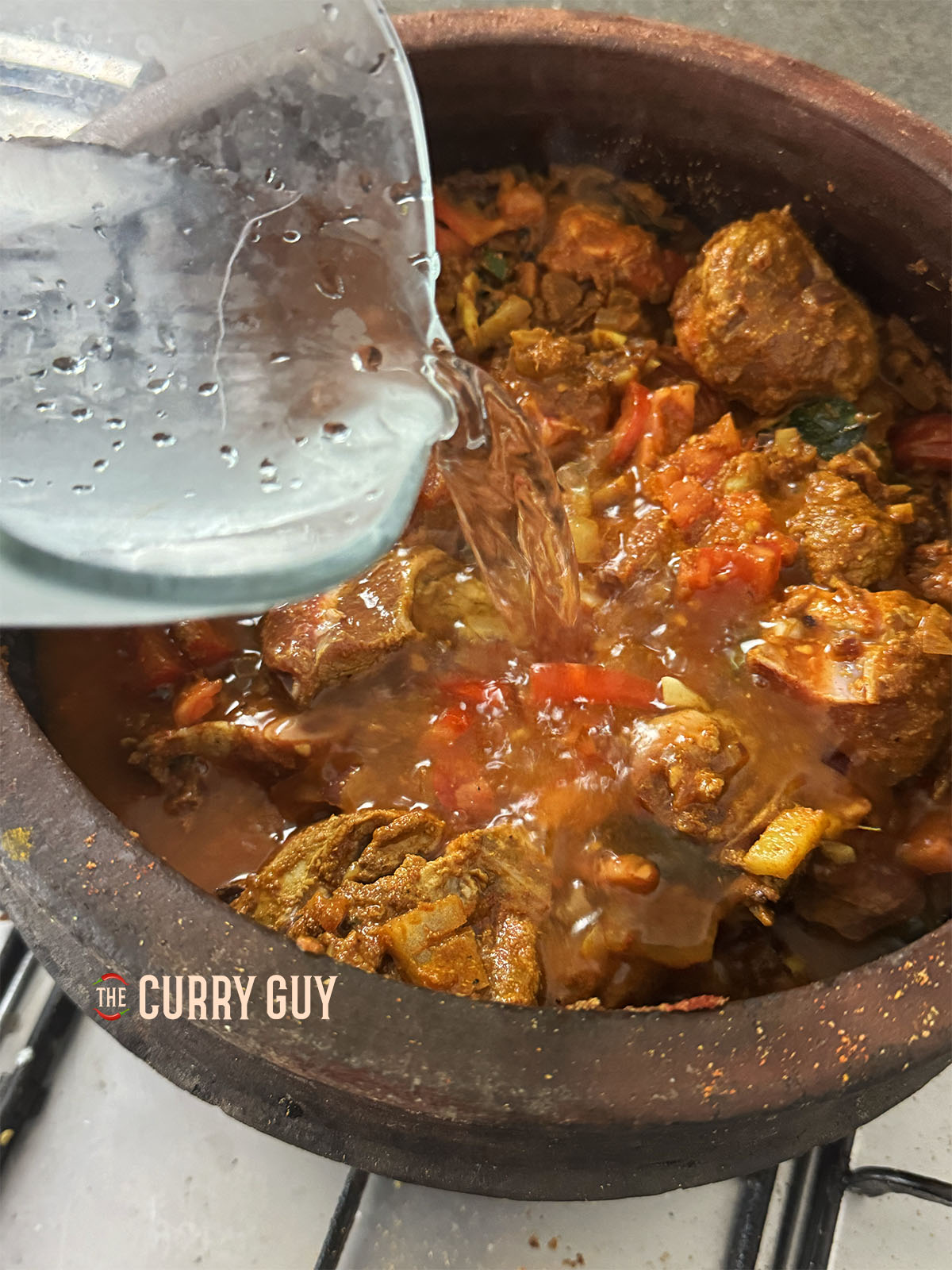 Showing how much water to add to the meat in the pot.