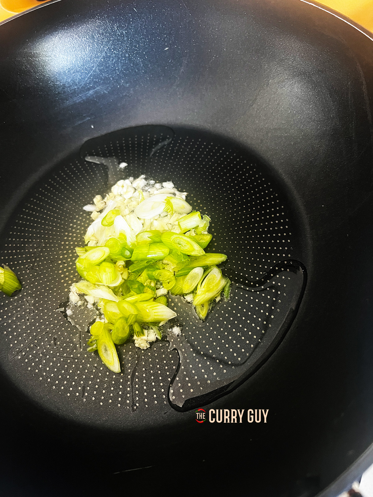 sautéing garlic and onion in a pan 