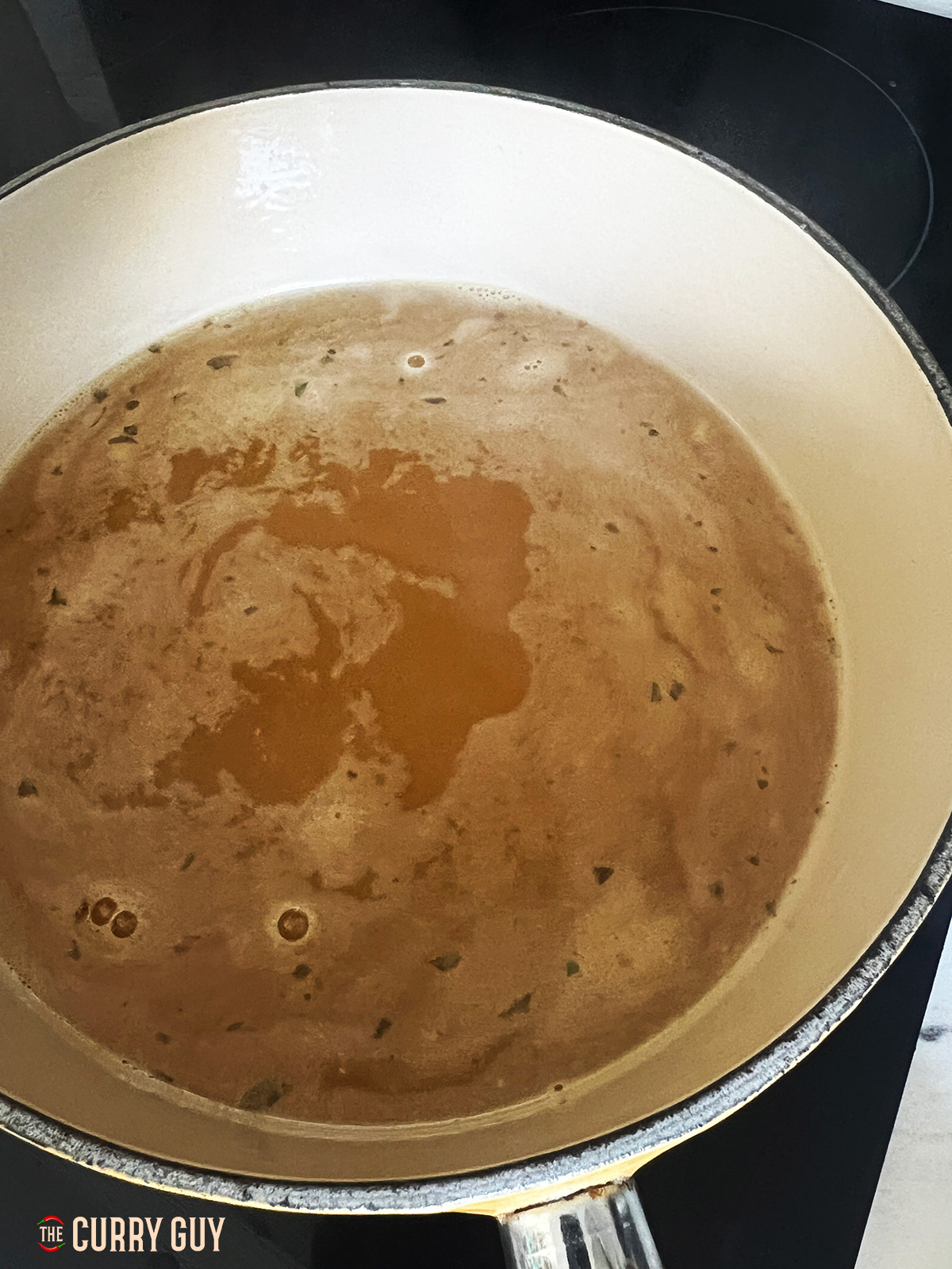 chicken stock in a pan simmering 
