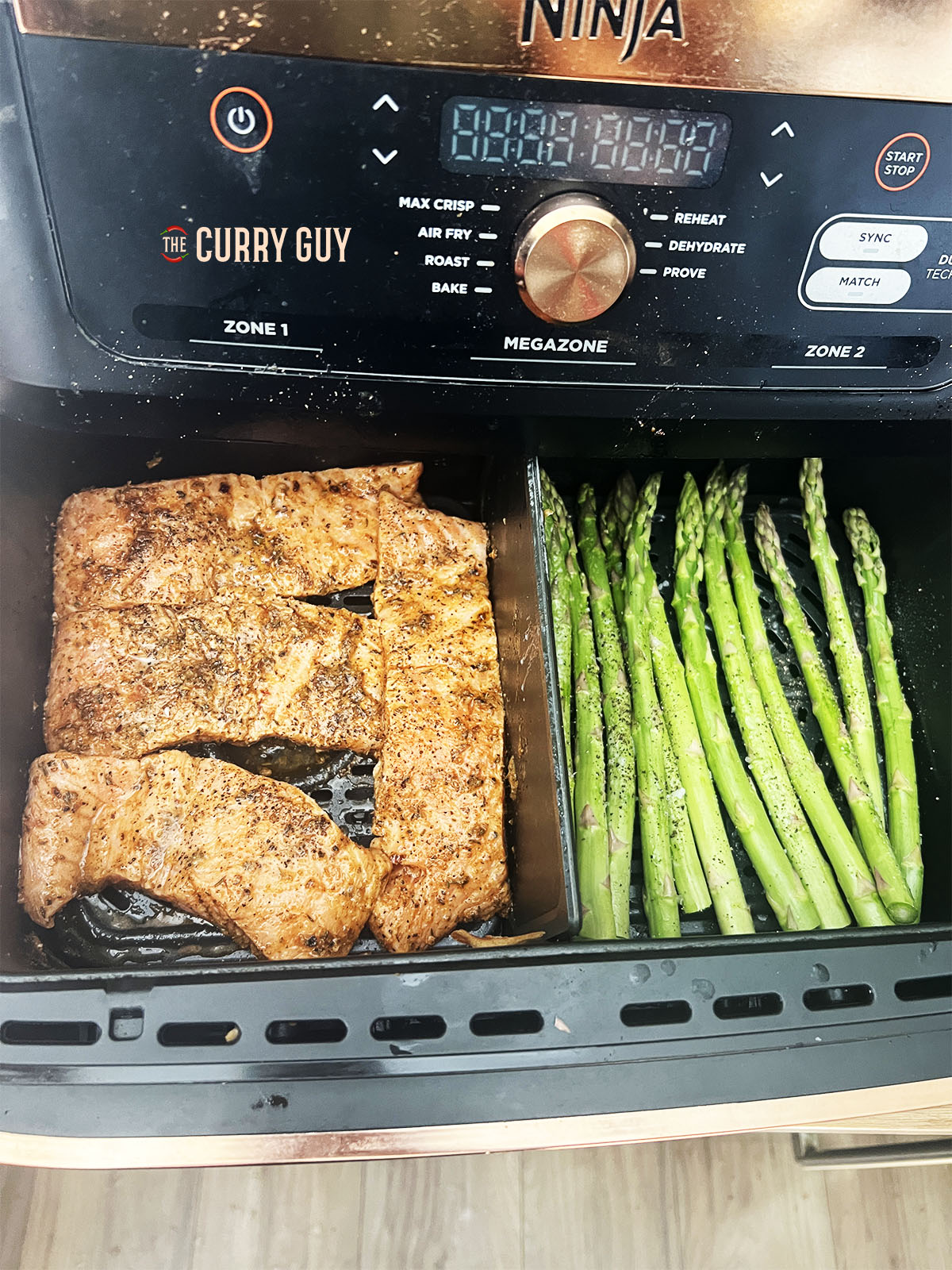 The salmon and asparagus placed in the air fryer