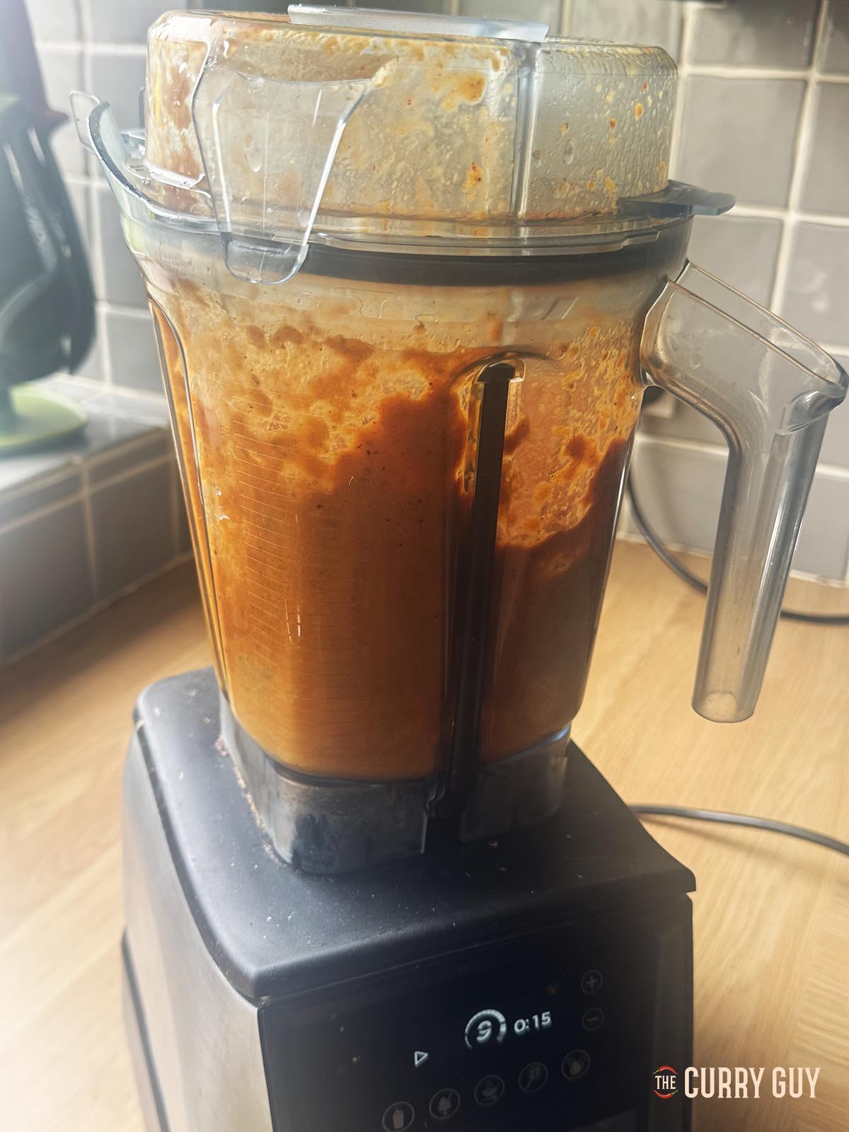 Blending the sauce ingredients until smooth in a blender.