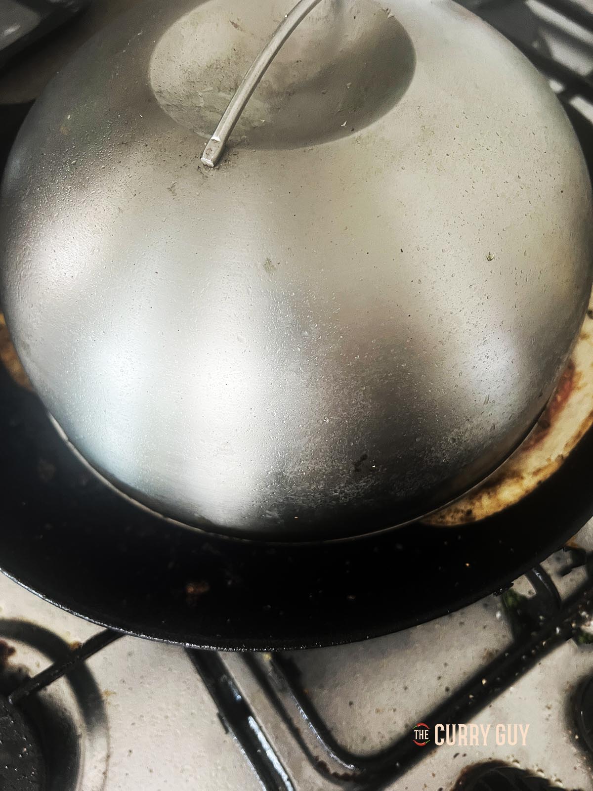 Cooking with a burger dome over the tacos to help melt the cheese.