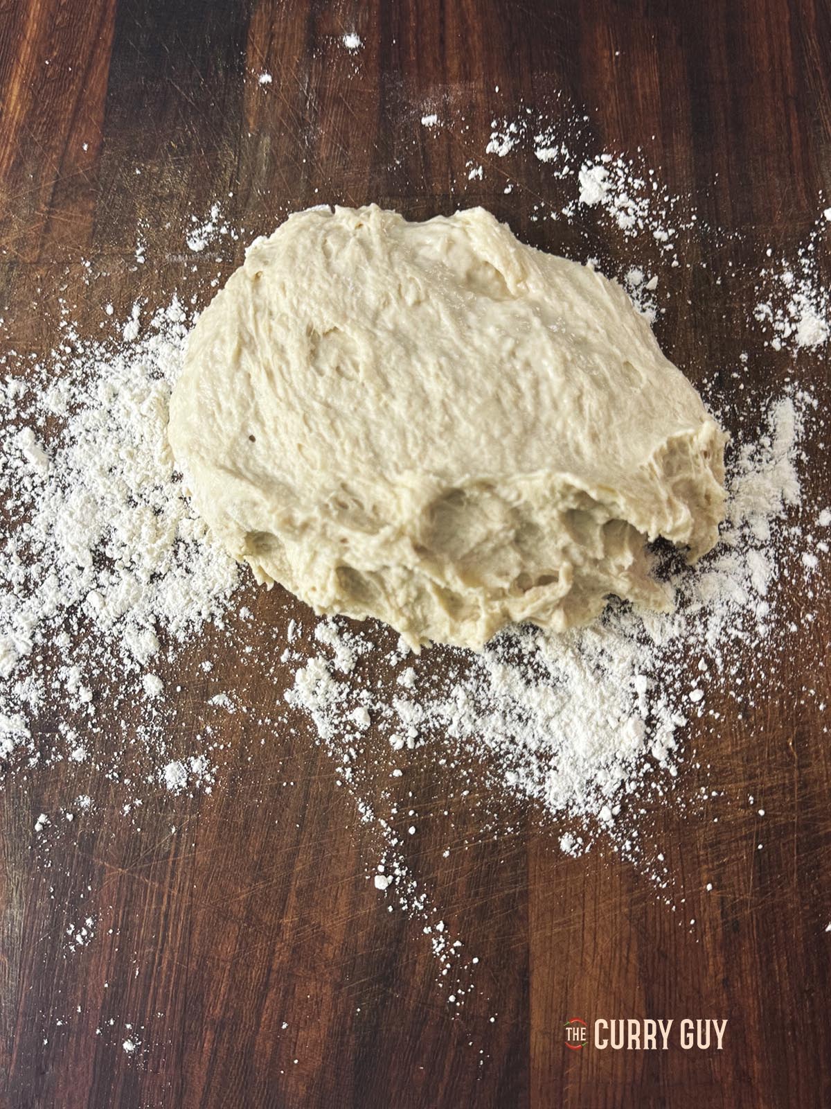 The dough ball on a clean work surface.