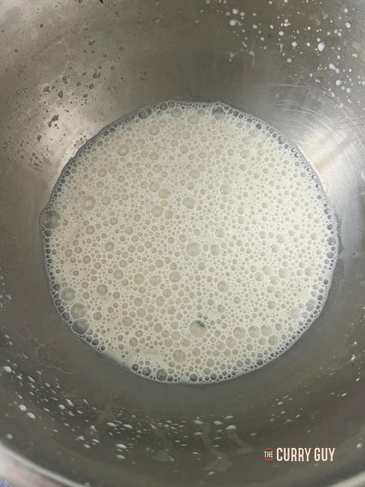 Frothy yeast in a bowl. 