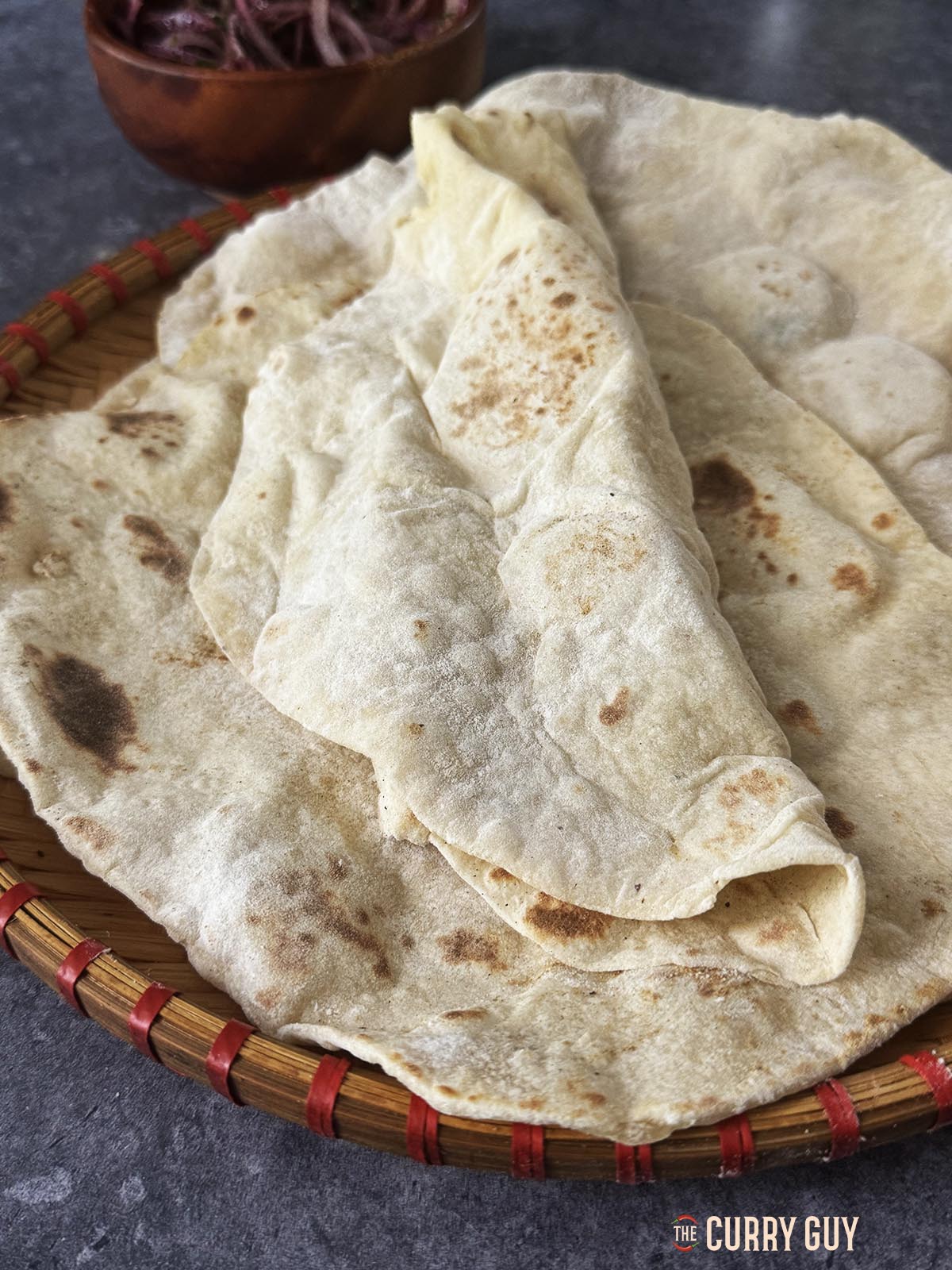 Homemade lavash bread on a serving plate.