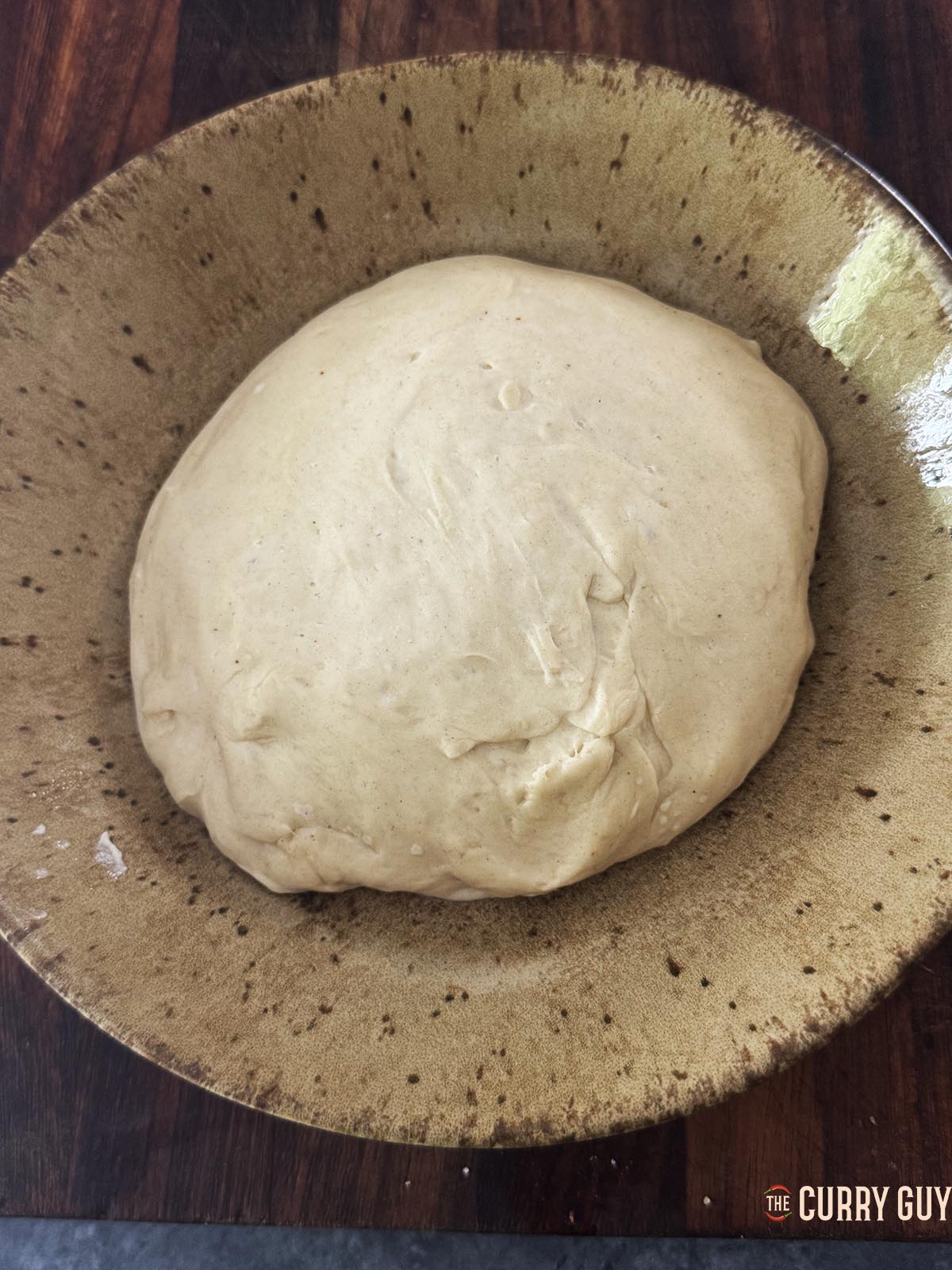 The dough ball about twice the size after rising.