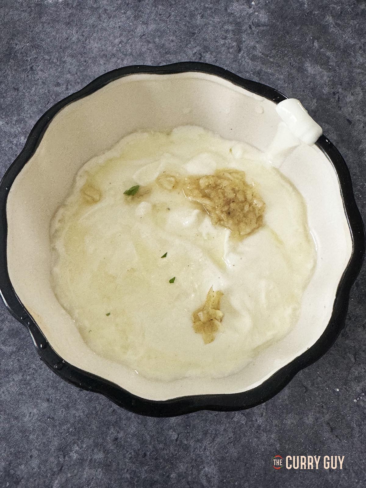 Mixing the yoghurt sauce ingredients together.