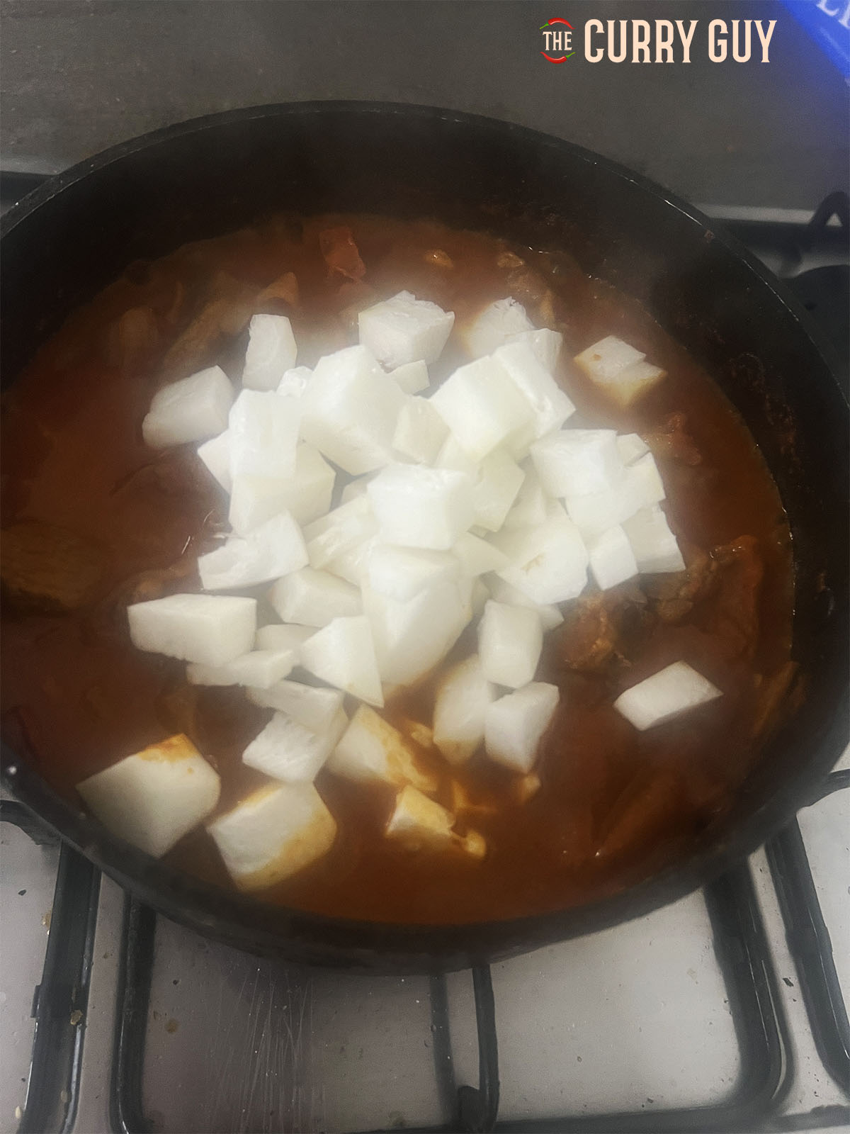 Adding the turnips to the pan. 