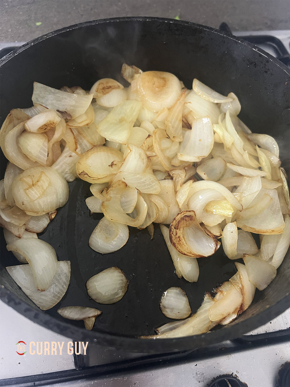 Frying the onions until golden brown. 