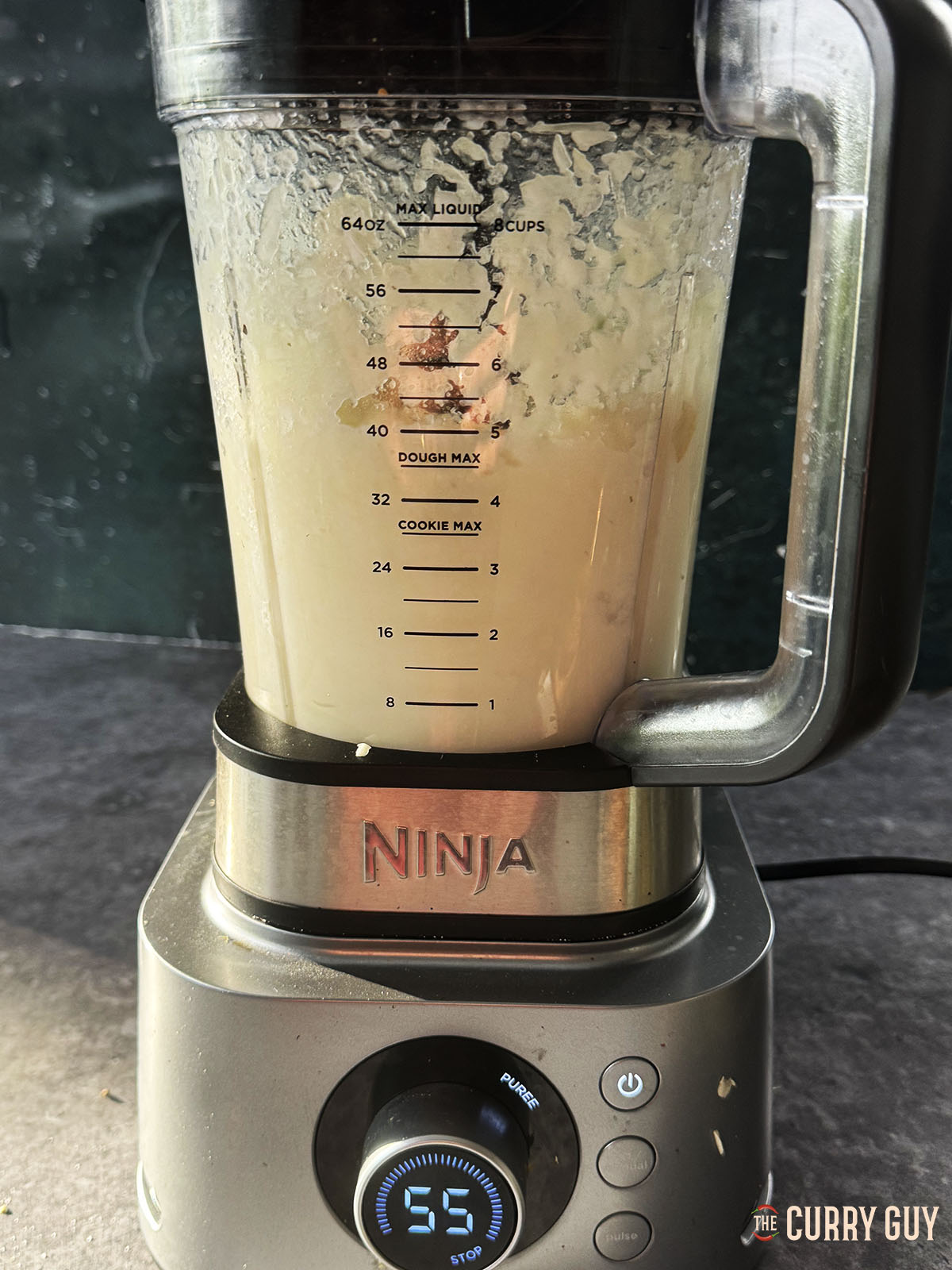 Blending the onions into a paste in a blender.