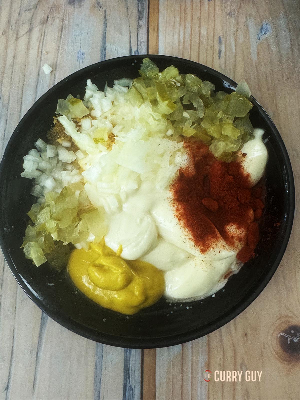 All of the burger sauce ingredients in a mixing bowl.