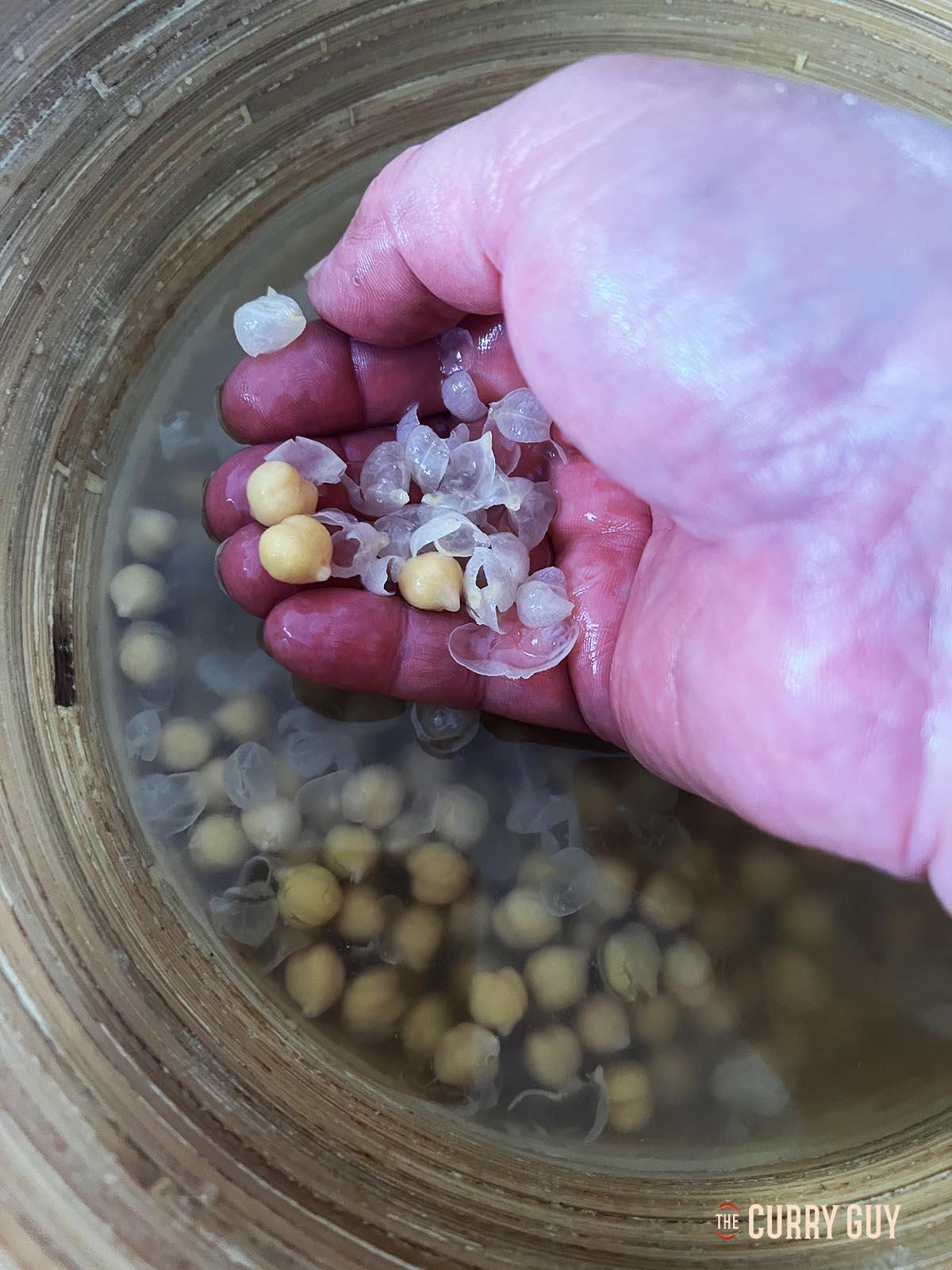 Showing the skins that have come off the chickpeas.