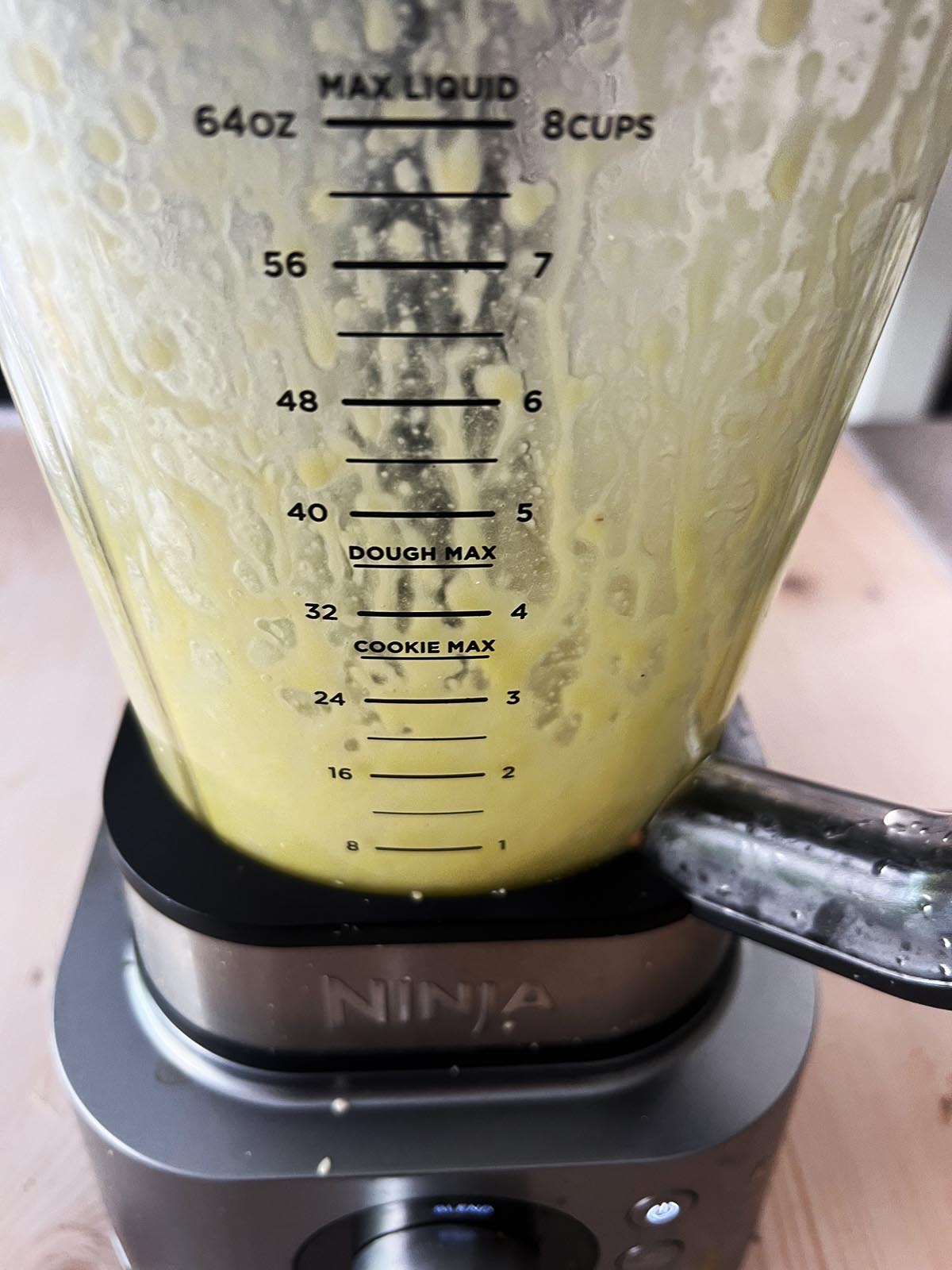 Blending the olive oil, lemon juice and garlic together to get the hummus started.