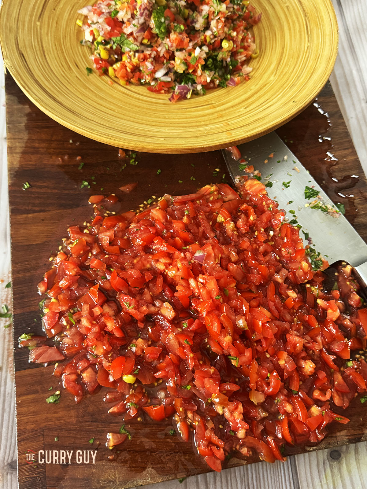Finely chopped tomatoes ready to add to the salad. 